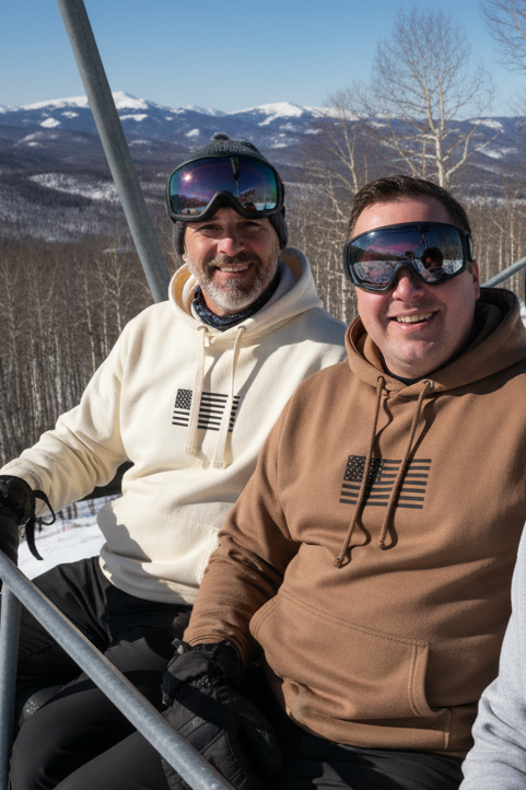 Three men on a ski lift with snowy landscape and clear blue sky