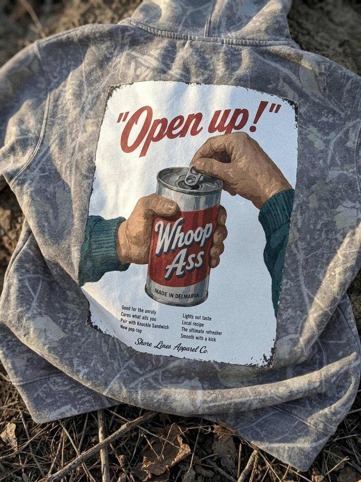 Whoop Ass camo hoodie with the Open up! vintage can ad printed on the back